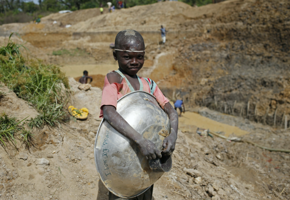 A boy takes a break as he searches for gold and diamonds near the town of Gaga April 6, 2014. REUTERS/Goran Tomasevic