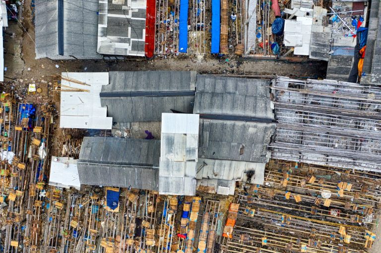 Puisi: Dunia Nan Agung Drone view of destructed roofs of small shabby houses located in dirty district on sunny day